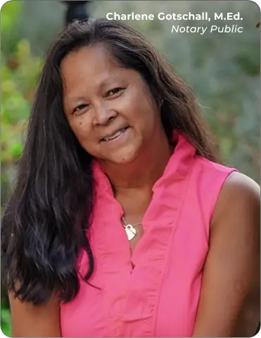 Black-haired notary Charlene Gotschall headshot, head angled to the left, wearing a sleeveless pink blouse and a necklace.